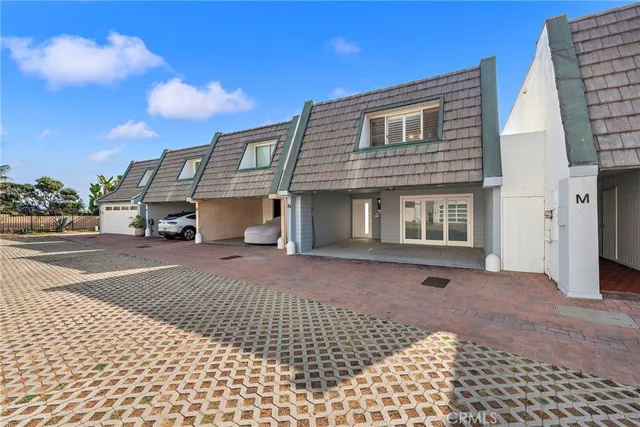 a bedroom with a bed and white cabinets