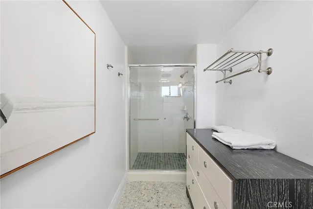 a view of a patio with couches table and chairs with potted plants
