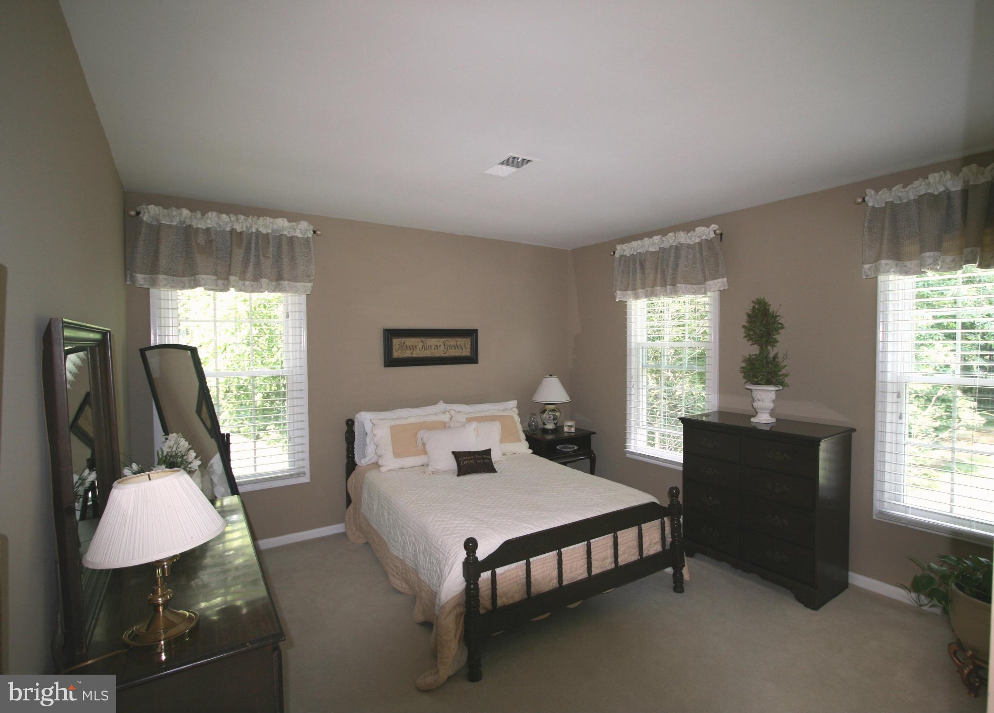 11939 Riders Lane Reston, VA 20191 - Photo 13 of 30 a bed room with furniture and a window
