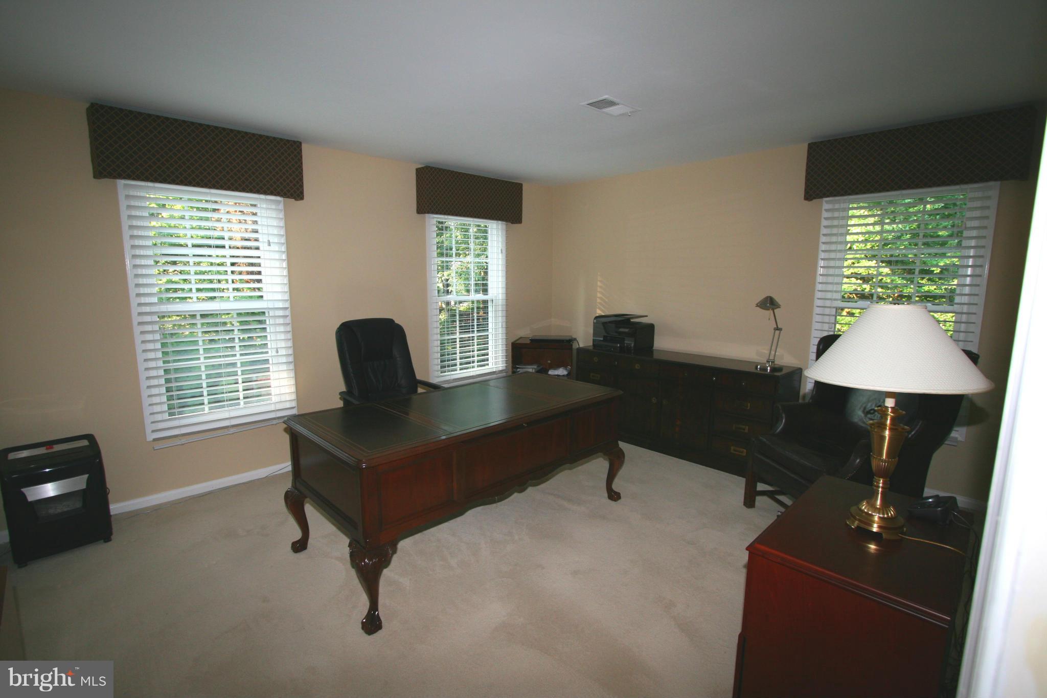 11939 Riders Lane Reston, VA 20191 - Photo 15 of 30 a living room with furniture and a window