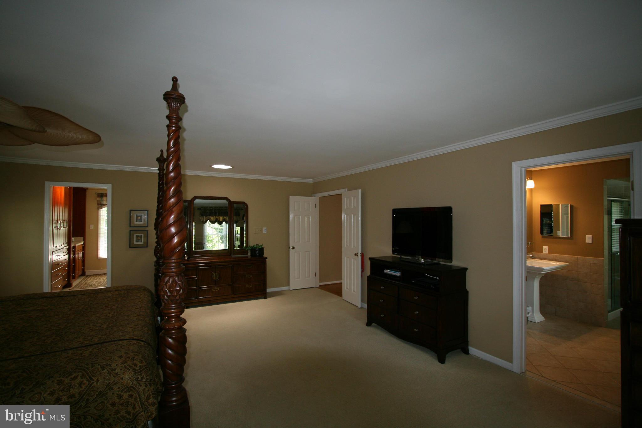 11939 Riders Lane Reston, VA 20191 - Photo 16 of 30 a living room with furniture and a flat screen tv