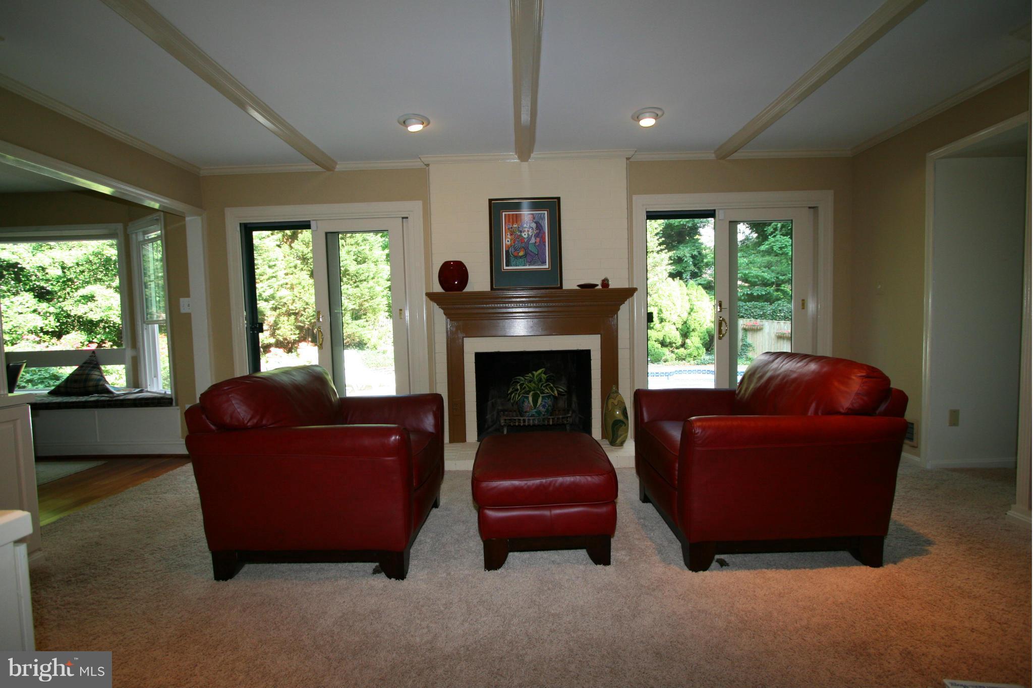 11939 Riders Lane Reston, VA 20191 - Photo 3 of 30 a living room with furniture and a fireplace