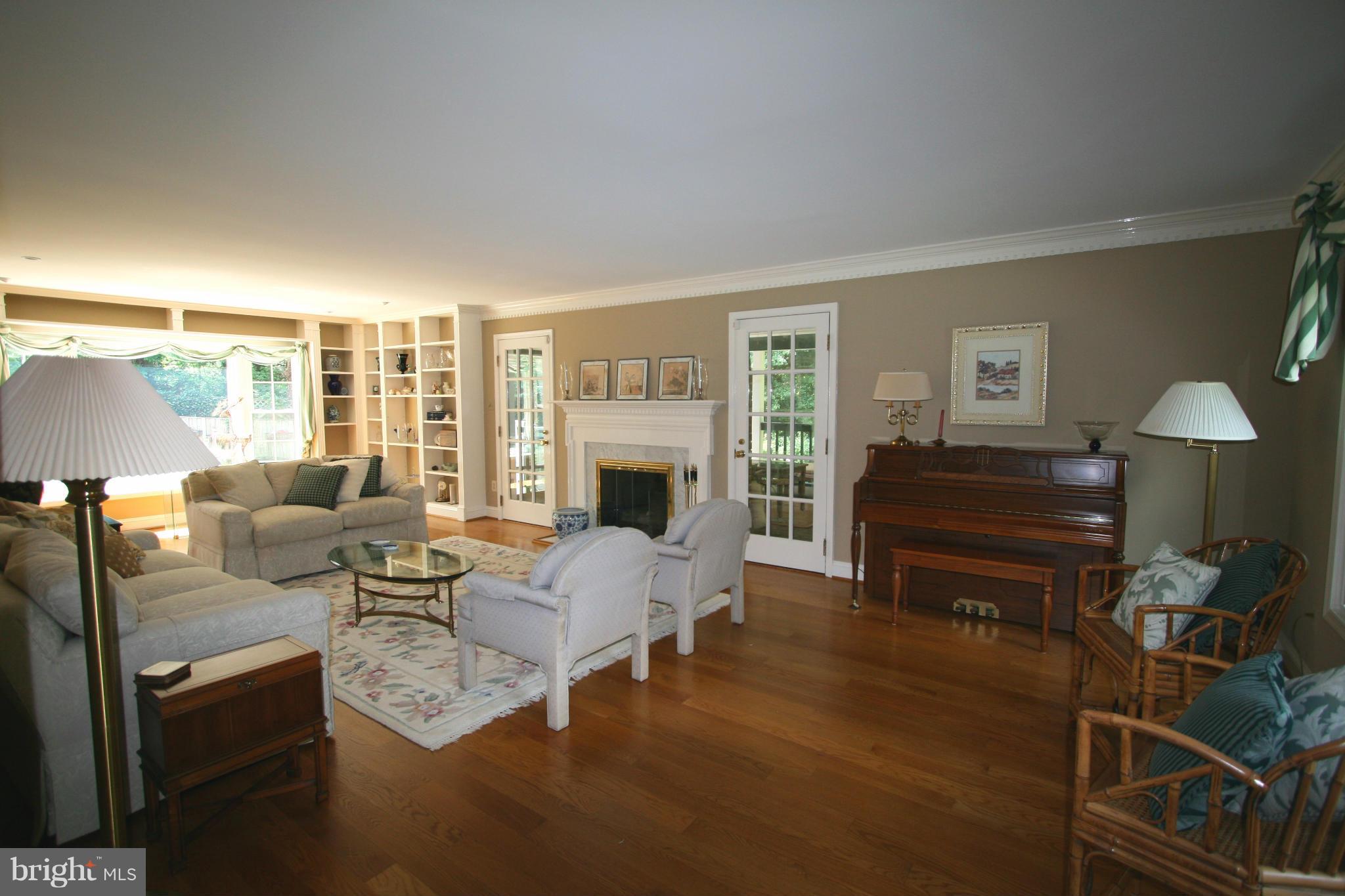 11939 Riders Lane Reston, VA 20191 - Photo 6 of 30 a living room with furniture fireplace and a table