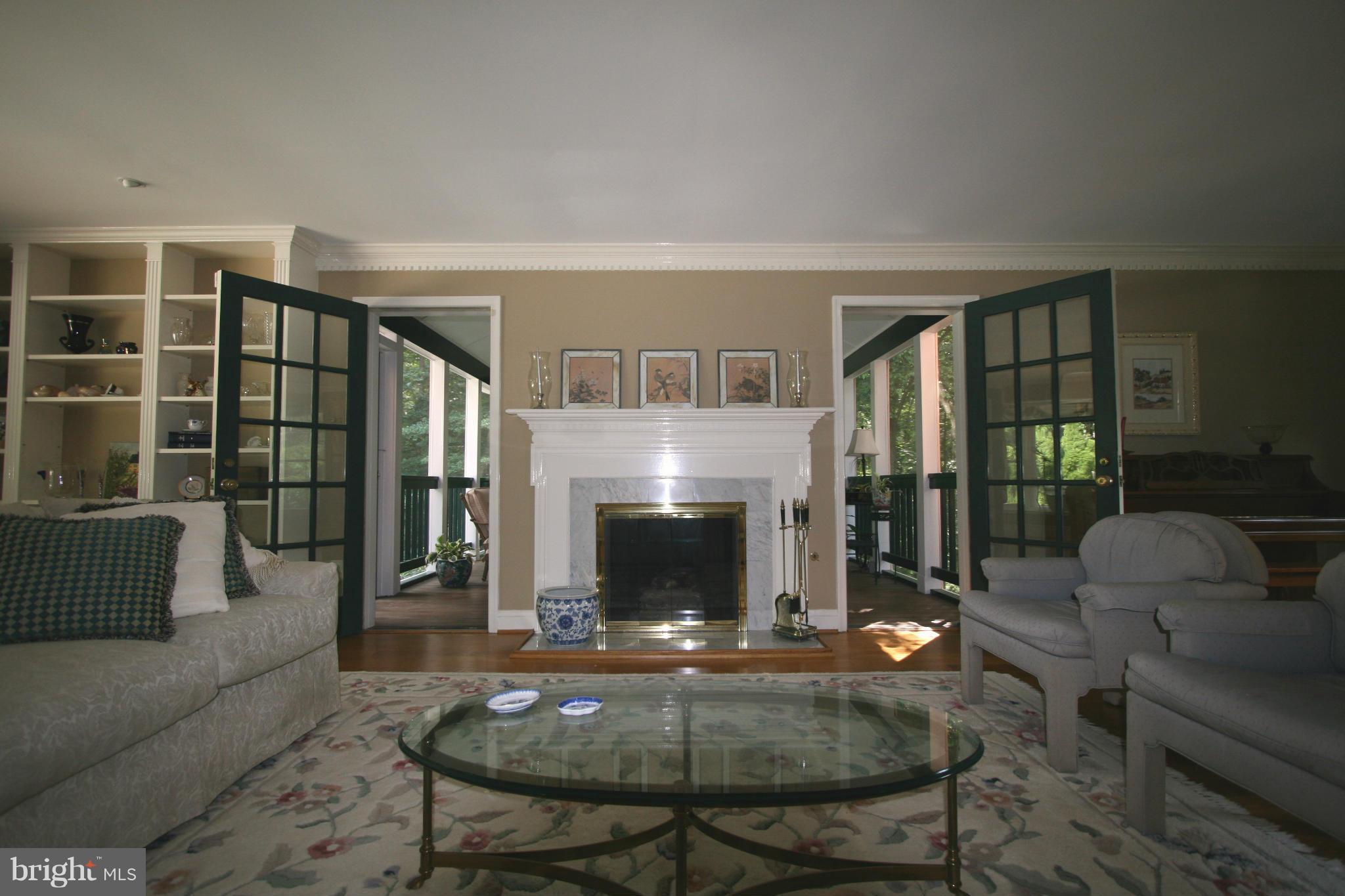 11939 Riders Lane Reston, VA 20191 - Photo 7 of 30 a living room with furniture and a fireplace