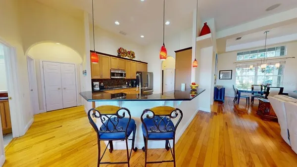 a view of a dining room with furniture and wooden floor