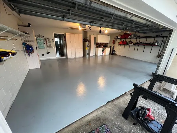 a view of a hallway with wooden floors