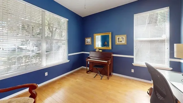 a workspace with furniture and a window