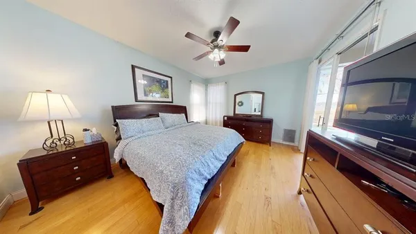 a bed room with a bed and a lamp