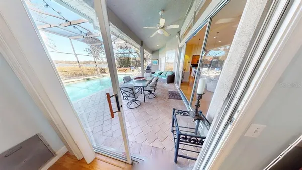 a view of living room with furniture and floor to ceiling window