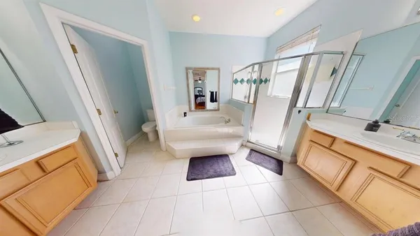 a bathroom with a sink a toilet and a shower