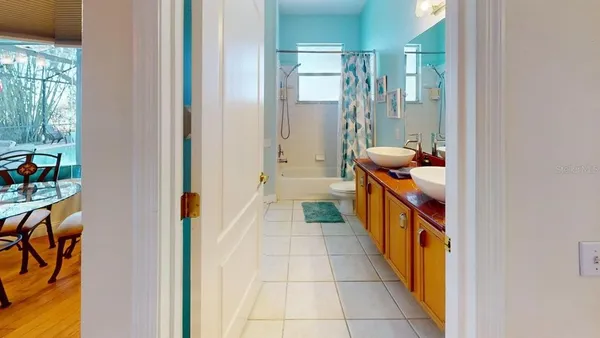a bathroom with a tub and shower