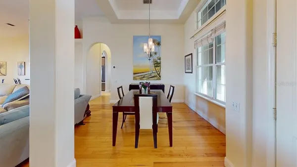a view of a dining room with furniture and wooden floor