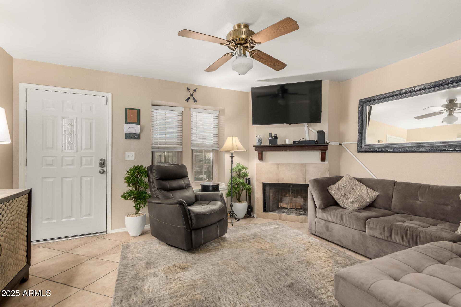 7977 West Wacker Road, Unit 171 Peoria, AZ 85381 - Photo 3 of 26 Neutral flooring and Fireplace