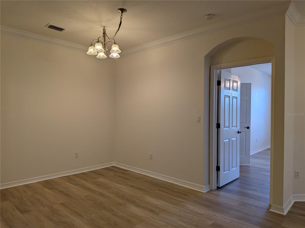 11562 Amidship Lane, Unit 208 Windermere, FL 34786 - Photo 11 of 31 a view of a room with wooden floor