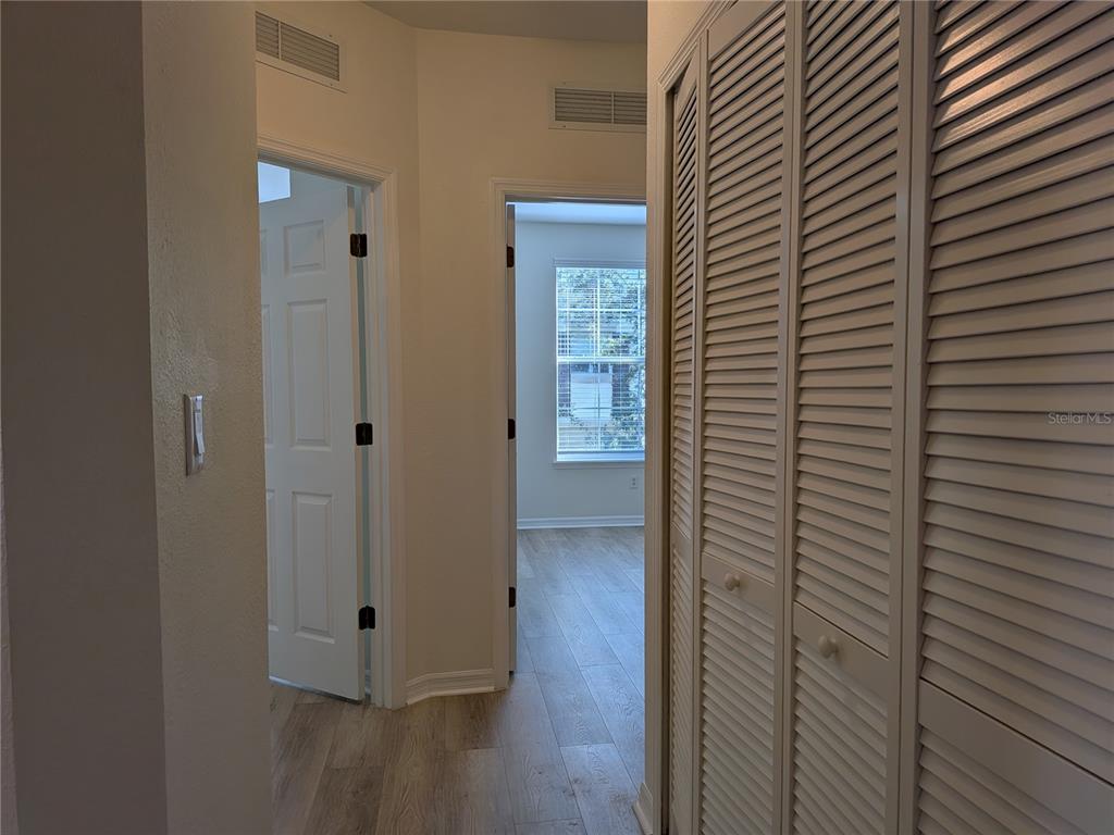11562 Amidship Lane, Unit 208 Windermere, FL 34786 - Photo 15 of 31 a view of hallway with wooden floor