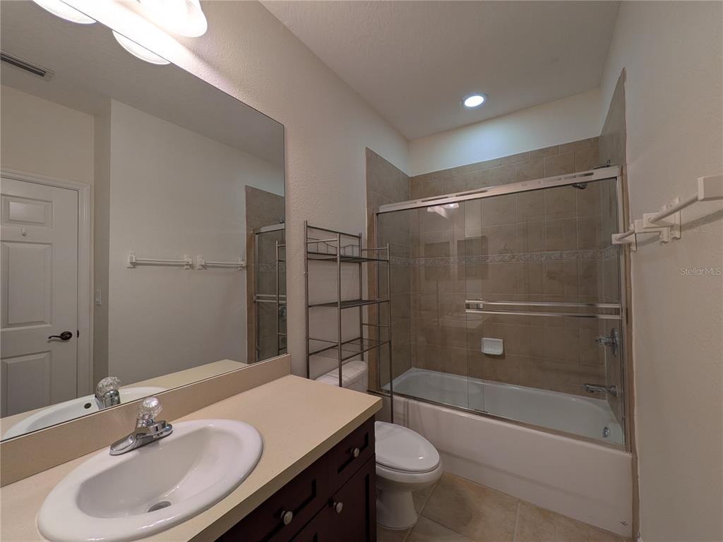 11562 Amidship Lane, Unit 208 Windermere, FL 34786 - Photo 18 of 31 a bathroom with a sink toilet and shower