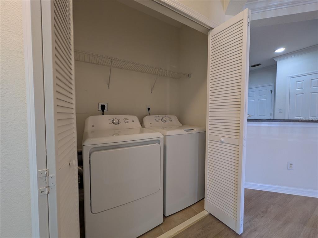 11562 Amidship Lane, Unit 208 Windermere, FL 34786 - Photo 21 of 31 a utility room with dryer and washer