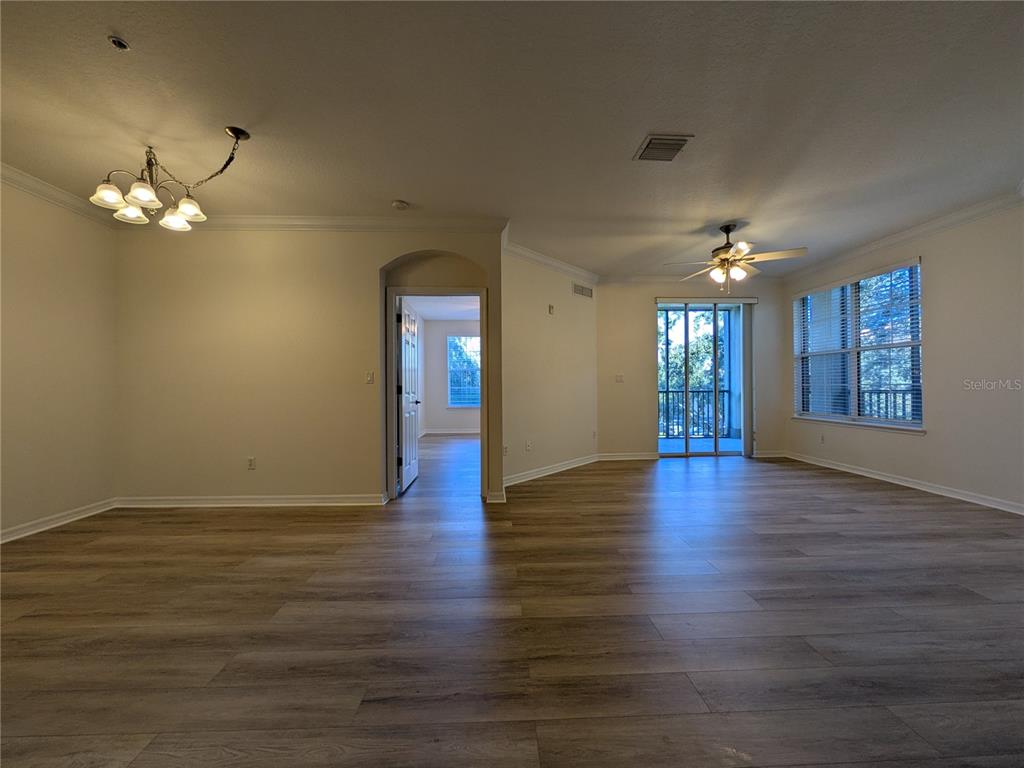 11562 Amidship Lane, Unit 208 Windermere, FL 34786 - Photo 22 of 31 a view of livingroom with hardwood floor and ceiling fan