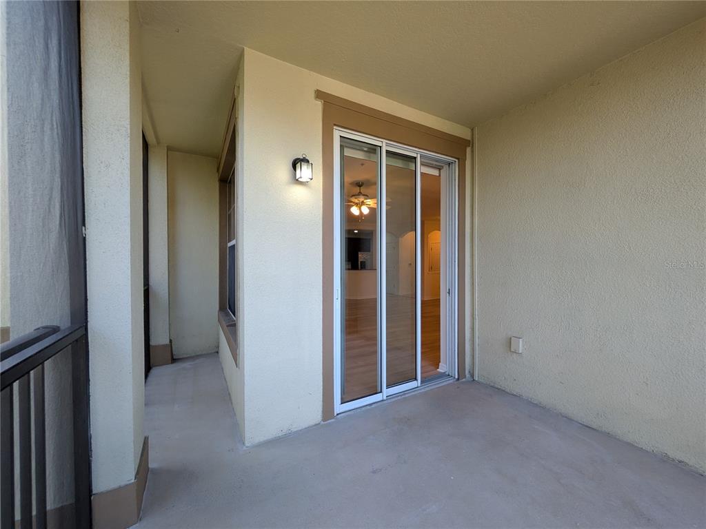 11562 Amidship Lane, Unit 208 Windermere, FL 34786 - Photo 28 of 31 a view of an empty room with closet and a window