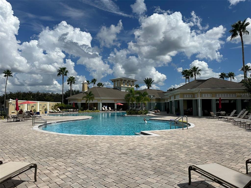 11562 Amidship Lane, Unit 208 Windermere, FL 34786 - Photo 30 of 31 a view of a swimming pool and a yard