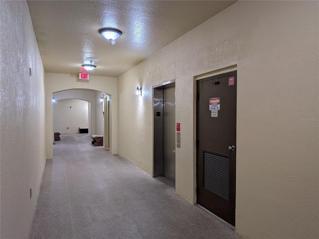 11562 Amidship Lane, Unit 208 Windermere, FL 34786 - Photo 3 of 31 a view of a livingroom with a staircase