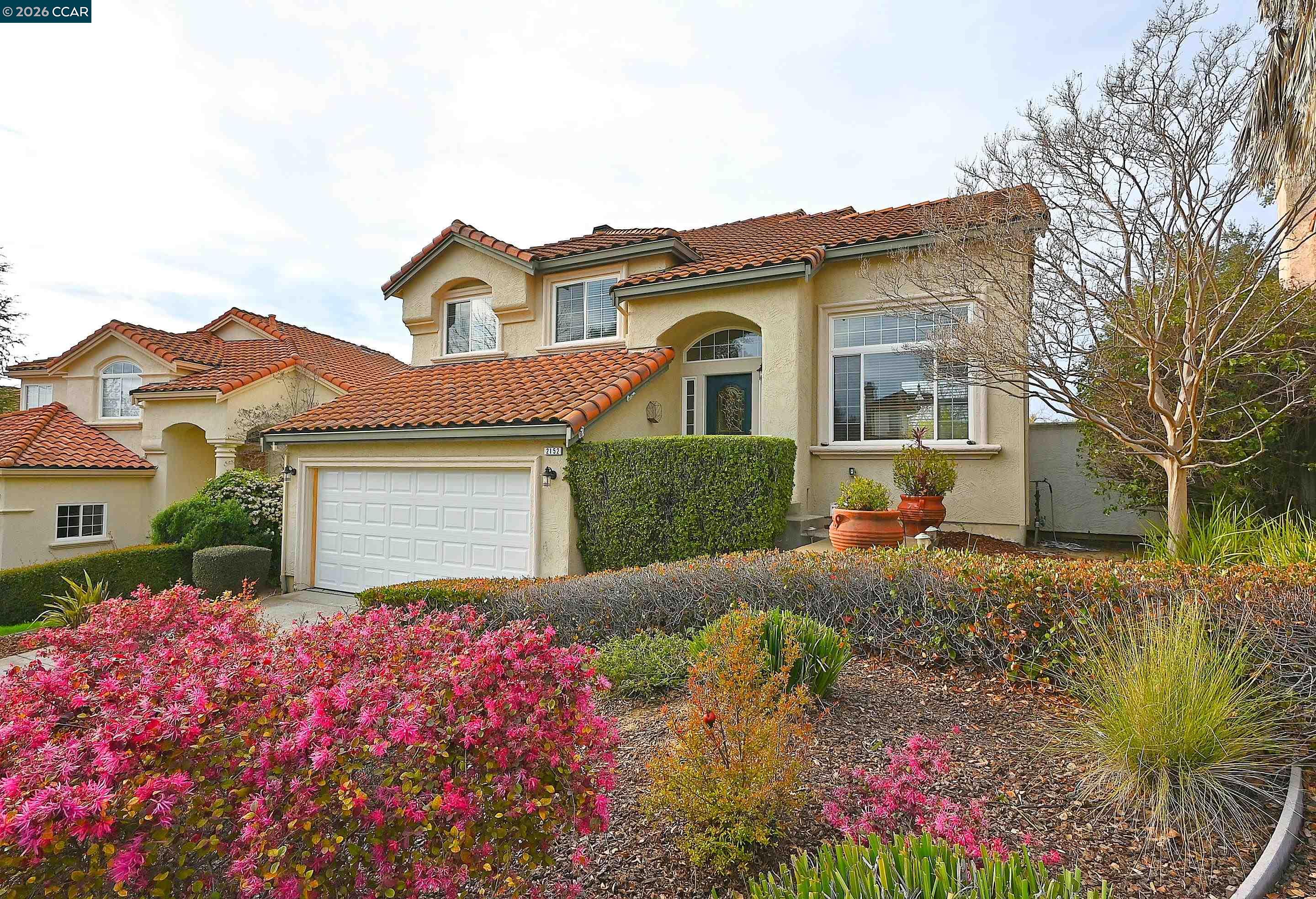 2152 Bluerock Circle Concord, CA 94521 - Photo 1 of 1 a front view of a house with a yard and garage