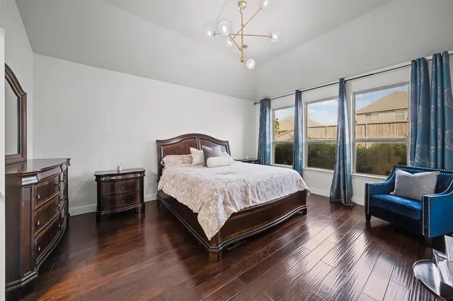 a bedroom with a bed and a couch