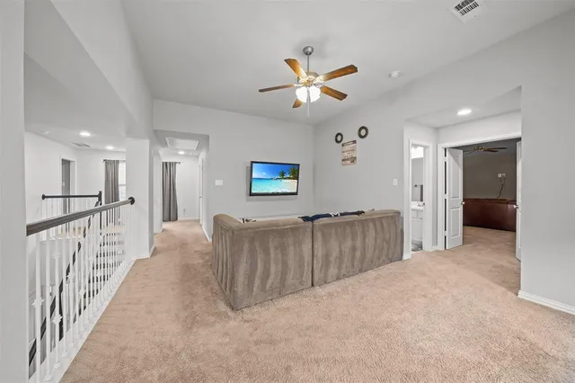 a view of a hallway with seating area