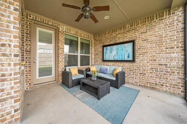 a view of a livingroom with couch and a workspace