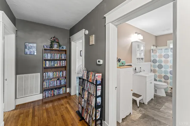 a kitchen with cabinets a window and appliances