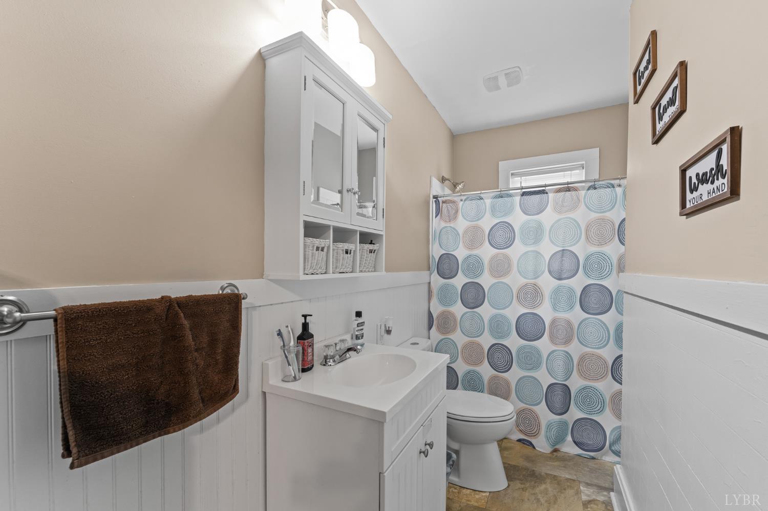 809 Broad Street Altavista, VA 24517 - Photo 18 of 50 a bathroom with a sink toilet and shower