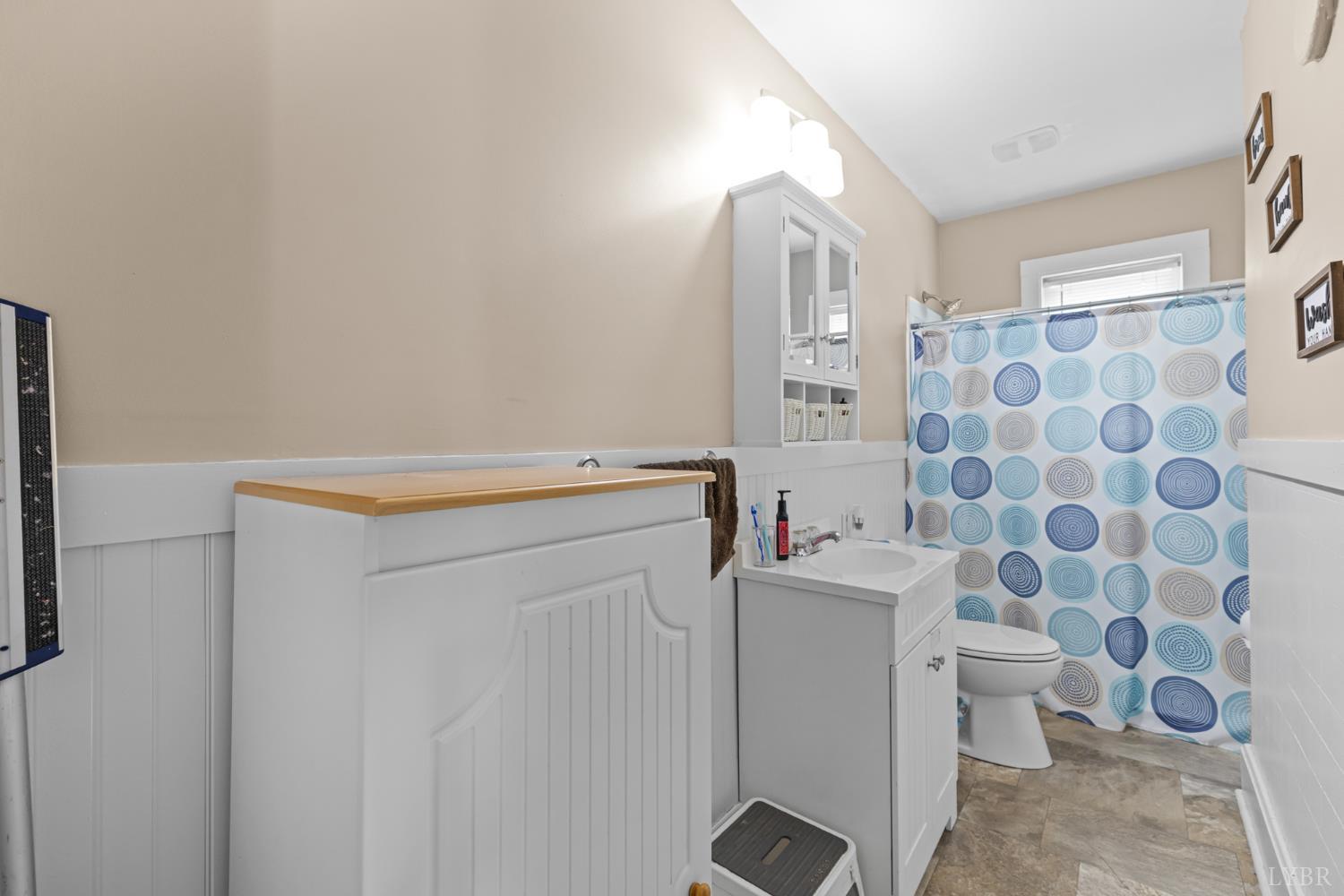 809 Broad Street Altavista, VA 24517 - Photo 19 of 50 a bathroom with a sink toilet and shower