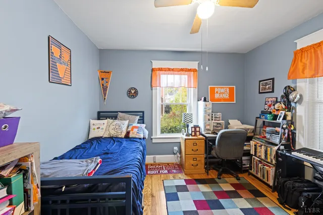 a living room with furniture a rug and a window