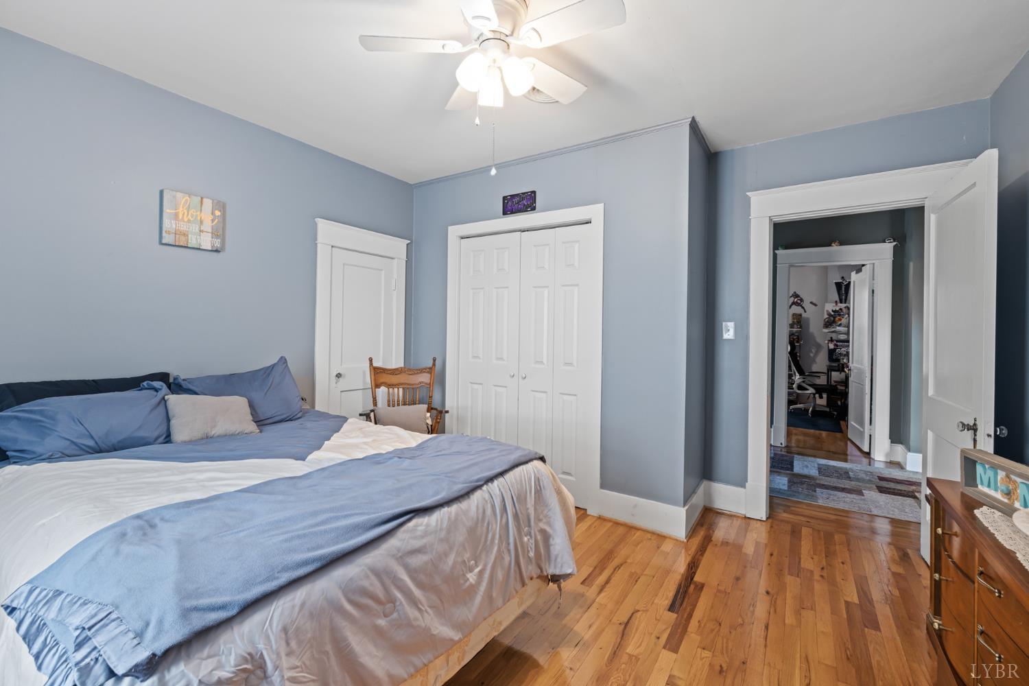 809 Broad Street Altavista, VA 24517 - Photo 28 of 50 a bedroom with a bed and a chandelier