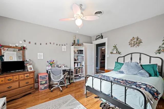 a bathroom with a sink vanity mirror and toilet