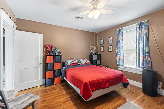 a bedroom with a bed furniture and a walk in closet