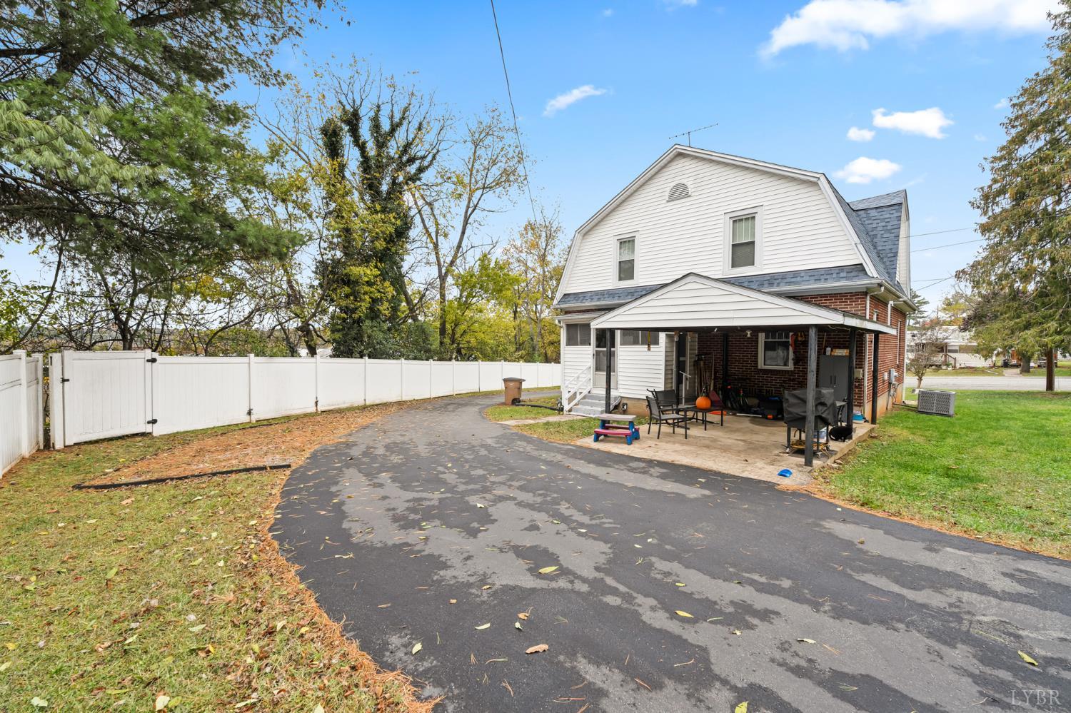 809 Broad Street Altavista, VA 24517 - Photo 46 of 50 a view of a house with backyard and trees
