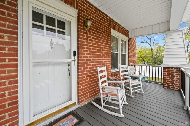 a porch with seating space and windows