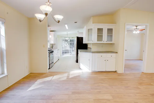 a kitchen with stainless steel appliances granite countertop a sink and cabinets