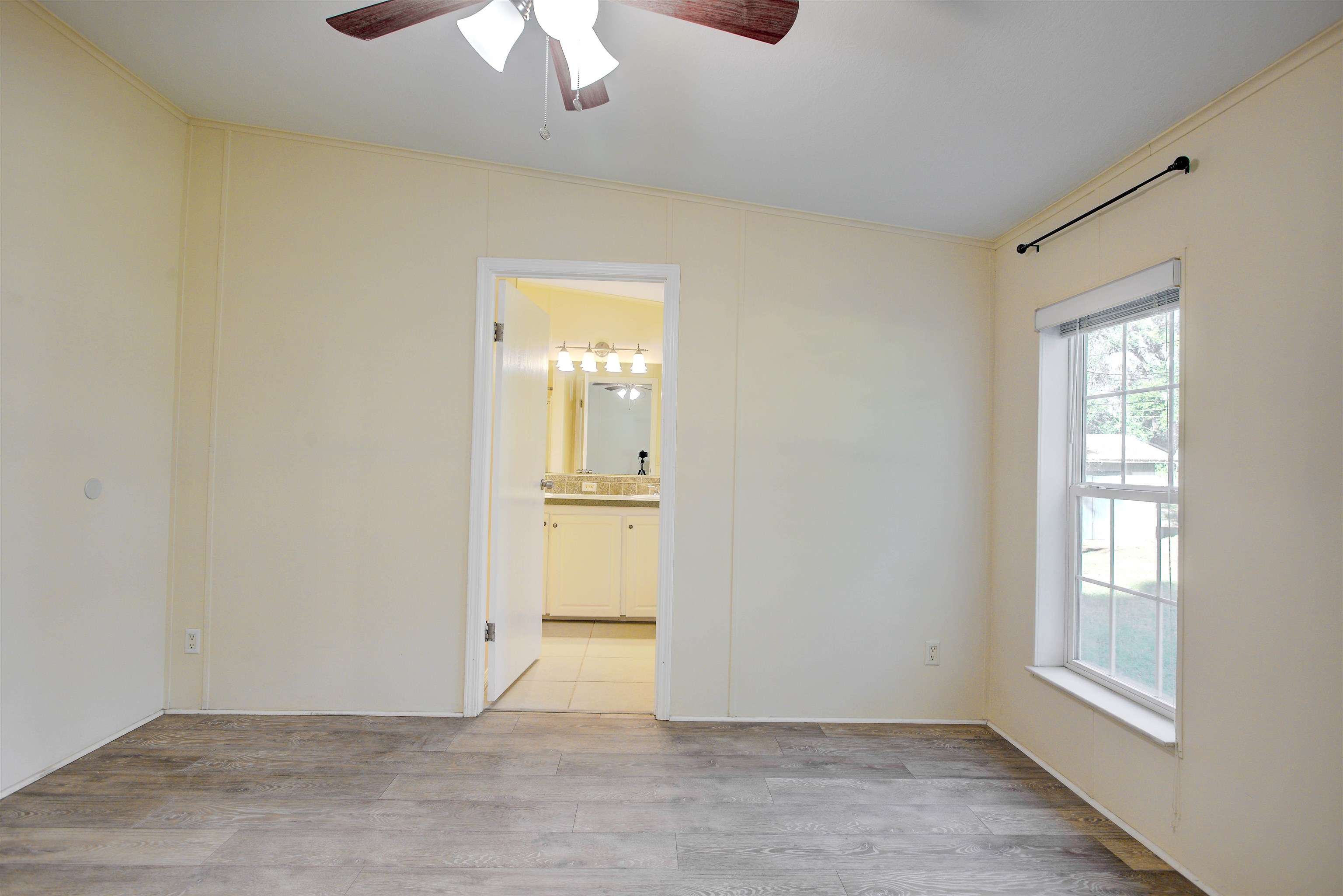 501 Hayley Road St. Augustine, FL 32086 - Photo 22 of 49 Spare room with light wood finished floors, a ceiling fan, and crown molding