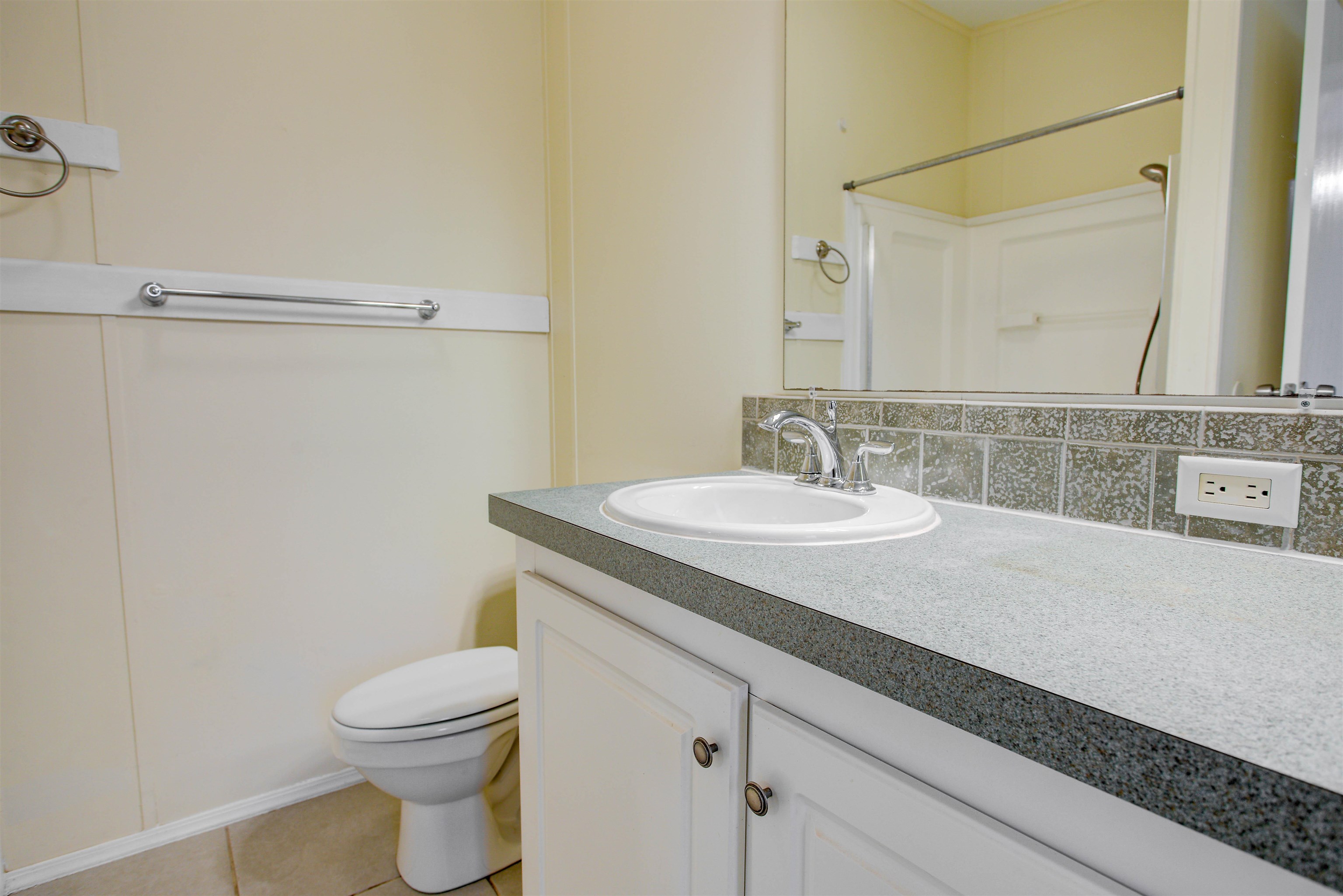 501 Hayley Road St. Augustine, FL 32086 - Photo 24 of 49 Full bath featuring vanity, tasteful backsplash, a shower with shower curtain, and light tile patterned floors
