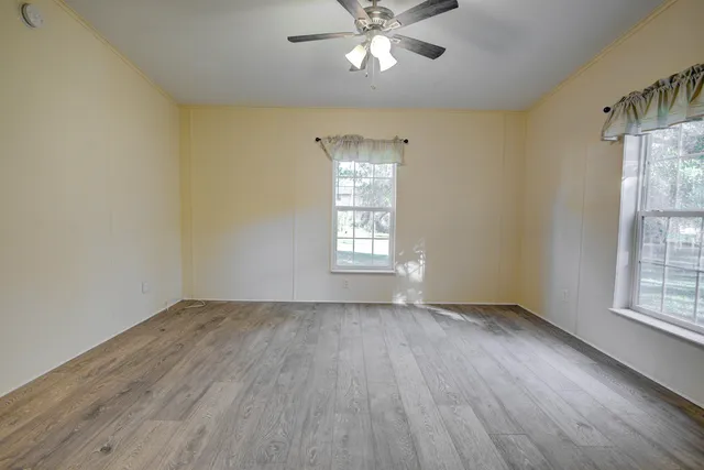 a view of entryway door with wooden floor