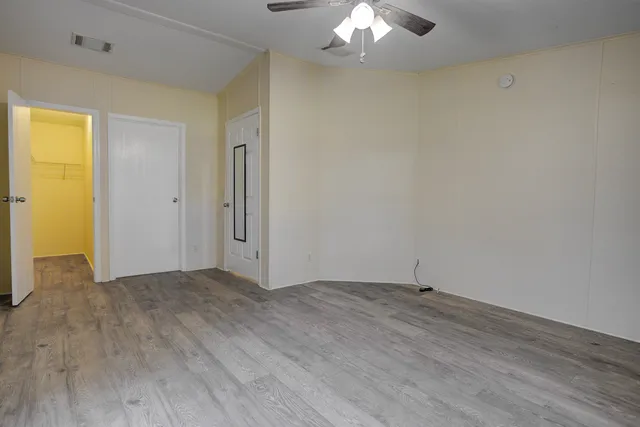 a view of a balcony with wooden floor