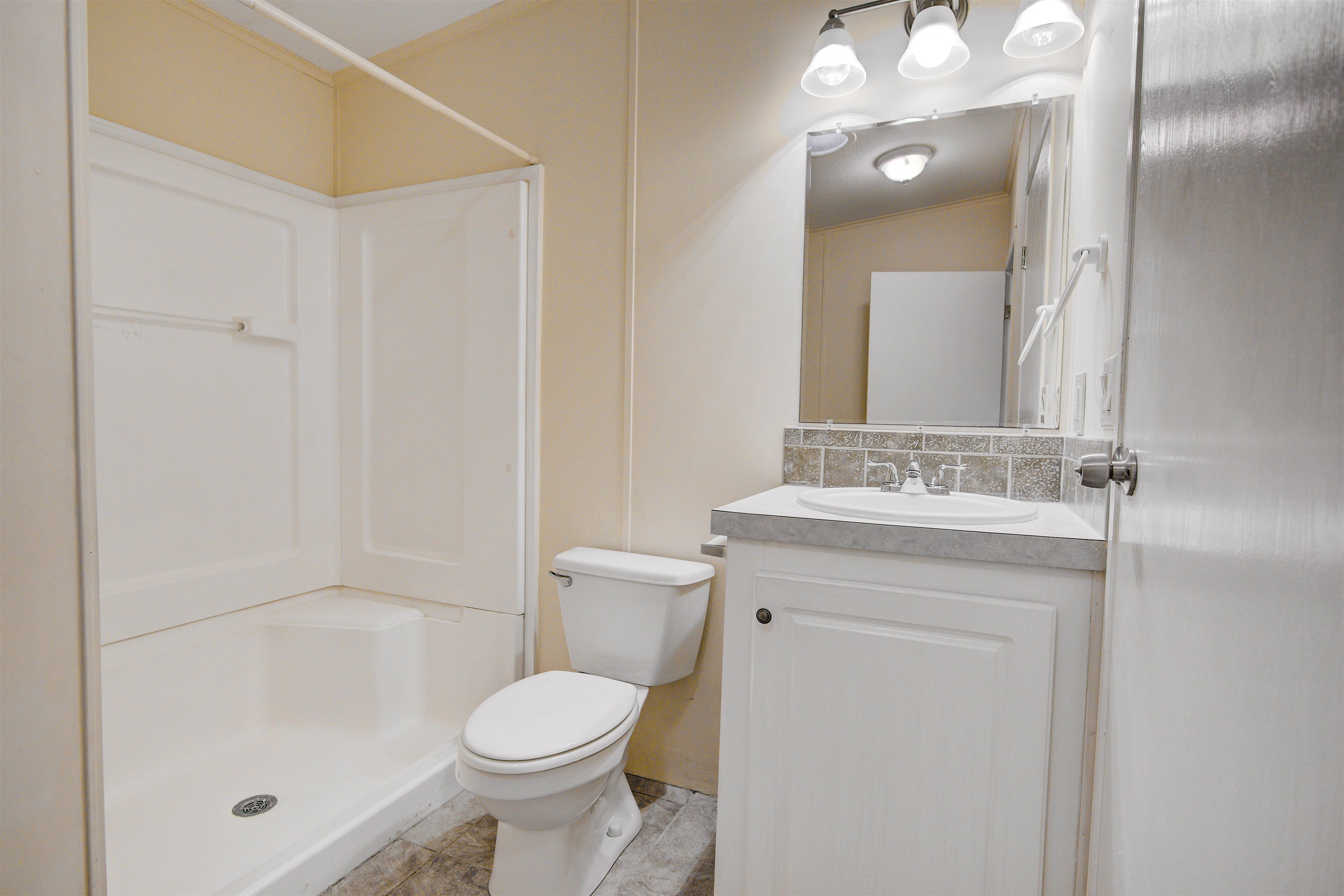 501 Hayley Road St. Augustine, FL 32086 - Photo 30 of 49 Full bath with tasteful backsplash, vanity, a shower, and light tile patterned floors