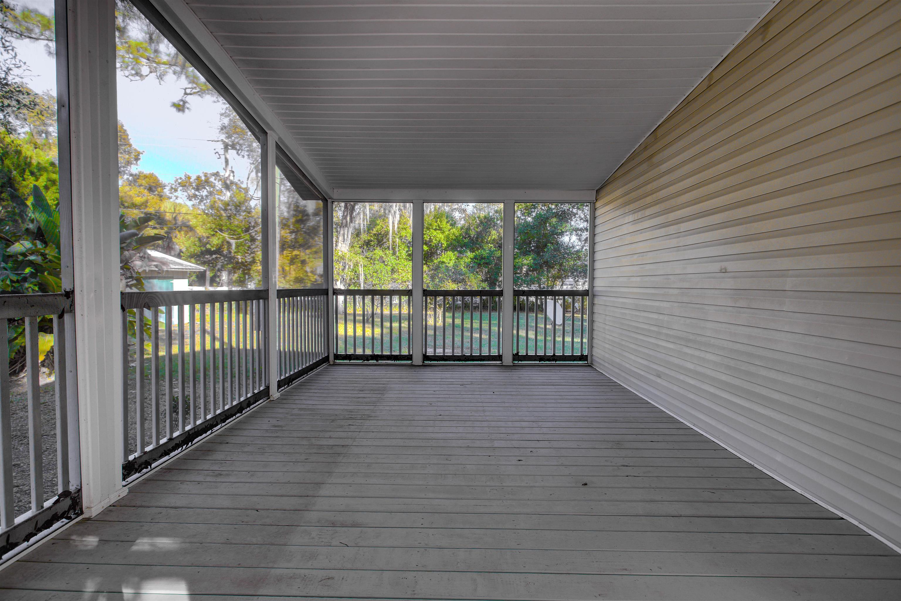 501 Hayley Road St. Augustine, FL 32086 - Photo 33 of 49 Wooden deck with a sunroom