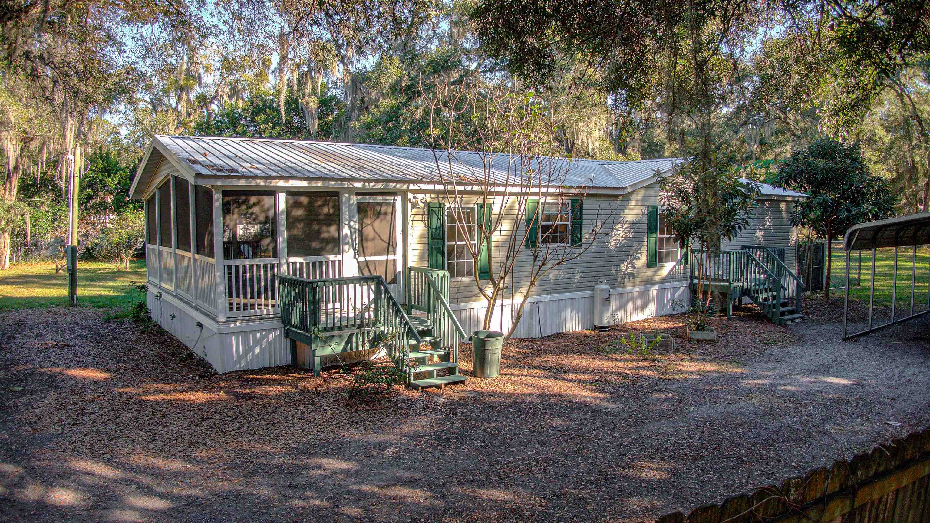 501 Hayley Road St. Augustine, FL 32086 - Photo 37 of 49 Manufactured / mobile home with a sunroom and a metal roof