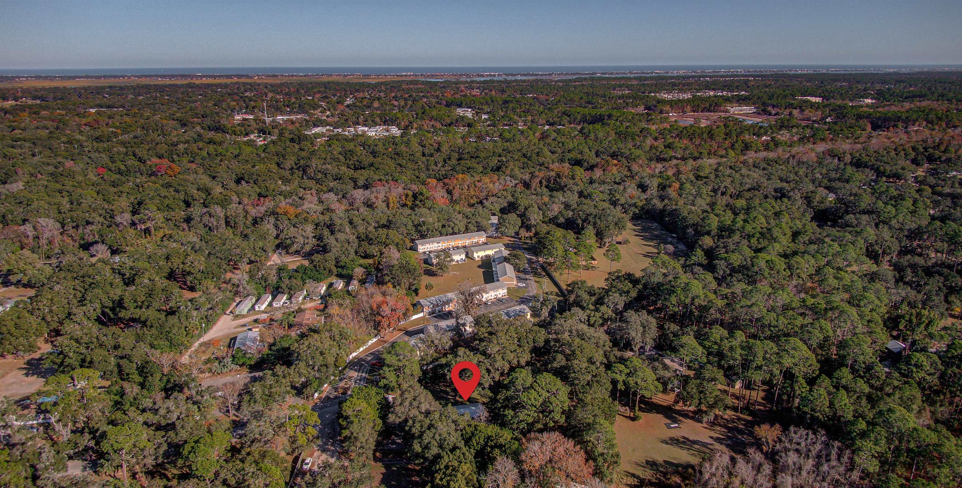 501 Hayley Road St. Augustine, FL 32086 - Photo 49 of 49 Aerial view of property and surrounding area featuring a forest