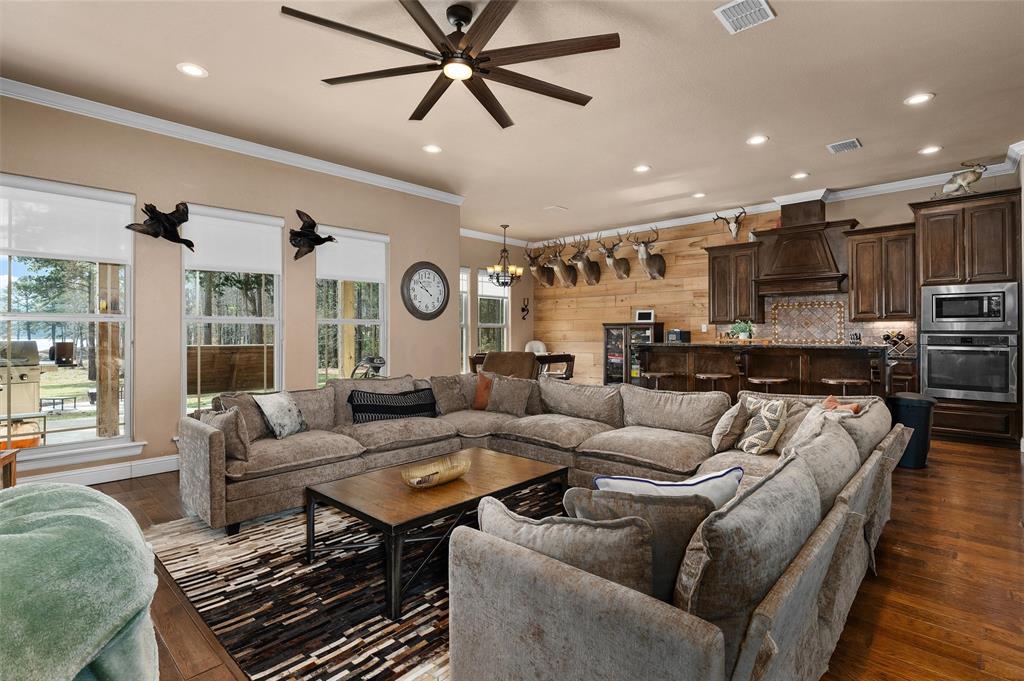 279 Lake Road Plain Dealing, LA 71064 - Photo 19 of 38 a living room with furniture kitchen view and a large window