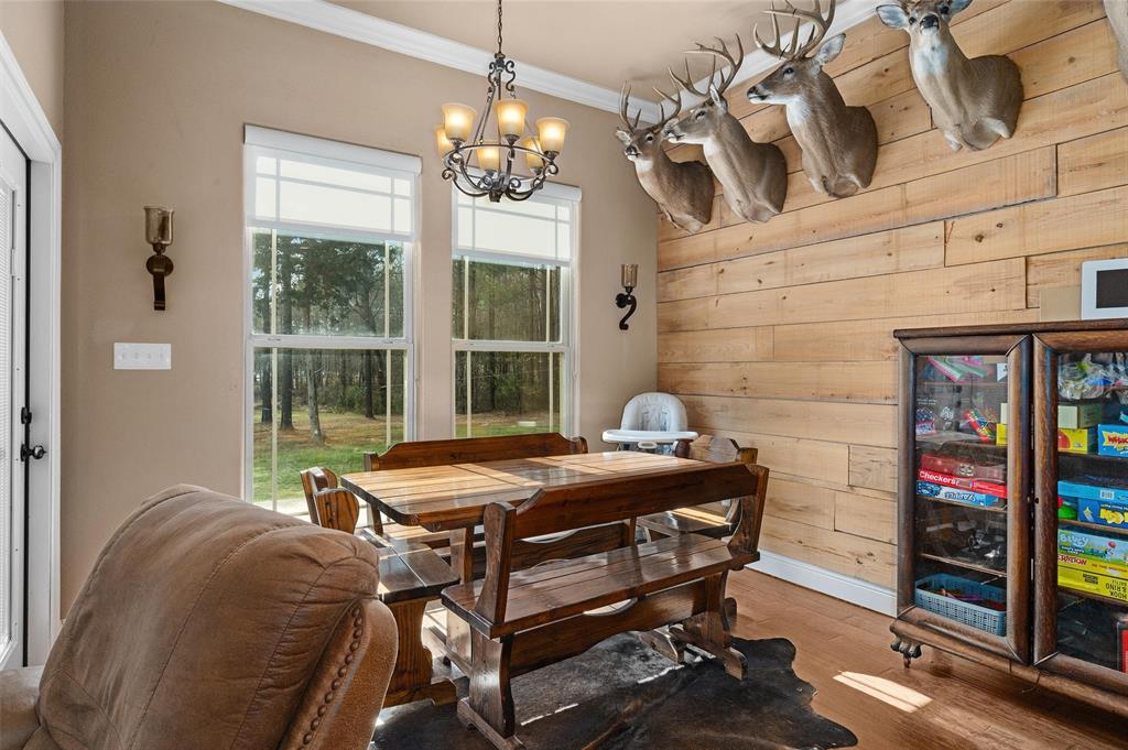 279 Lake Road Plain Dealing, LA 71064 - Photo 23 of 38 a dining room with furniture and window