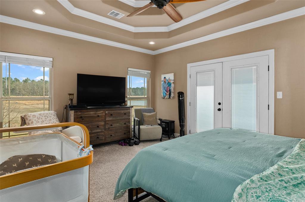 279 Lake Road Plain Dealing, LA 71064 - Photo 24 of 38 a bedroom with bed and flat screen tv